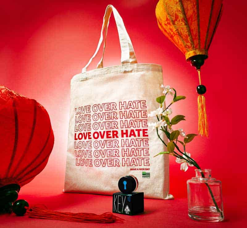 Love Over Hate Tote Bag with Red Background