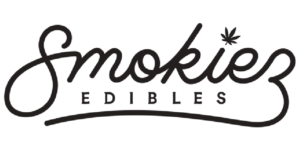 The image shows the Smokiez Edibles logo in black script, with a small cannabis leaf symbol above the letter "i" in "Smokiez. Smokiespng