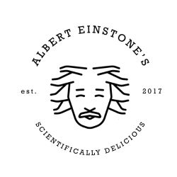 Black line drawing of a stylized face with wild hair inside a circular logo. Text reads "Albert Einstone's," "est. 2017," and "Scientifically Delicious. Alber-Einstonesjpg