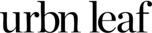 A black cat sits facing forward with its tail curled around its body, depicted in a simple black silhouette style. URBN-Leaf-Logo-e1743524619380png