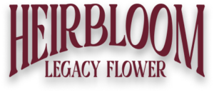 The image displays the text "HEIRBLOOM LEGACY FLOWER" in large, stylized, dark red letters with a slight shadow effect. heirbloom-link-imgpng