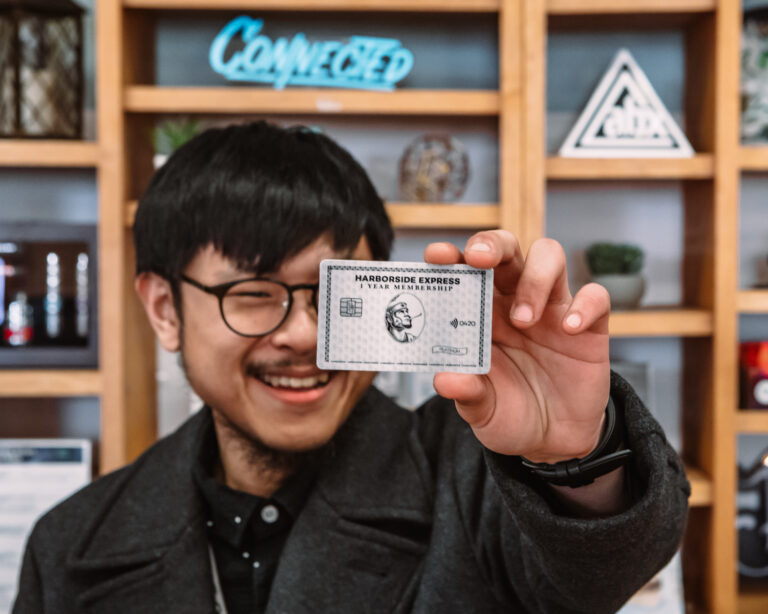 Harborside Budtender displaying the Membership Club Card BC6A9357