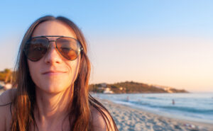  A beautiful woman is sitting on the beach