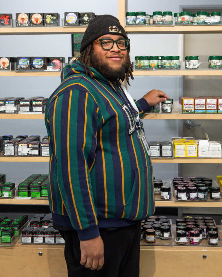 Harborside Budtender with Products at the Storefront BC6A9912